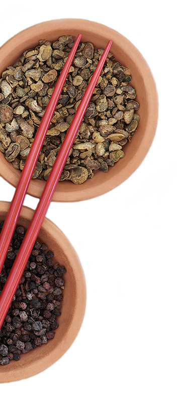spice-bowls-with-chop-sticks chopsticks laid on top of bowls of herbs and spices